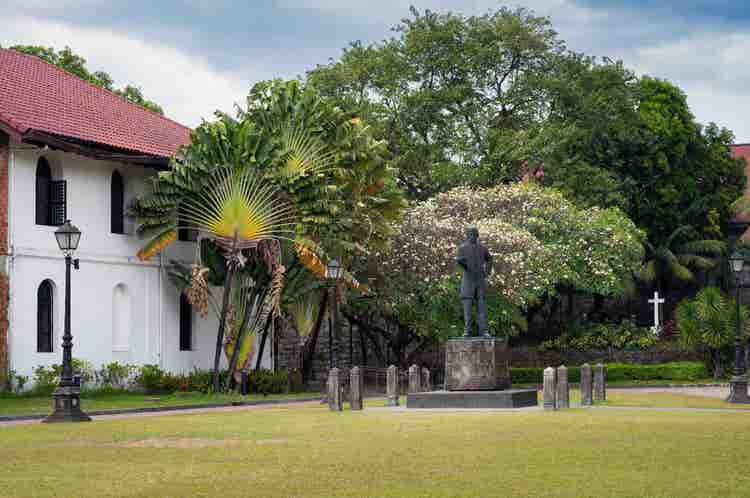 Iconic monument surrounded by landscaped gardens, historic architecture, cultural significance, peaceful atmosphere, impressive design, and memorable sightseeing experience together.